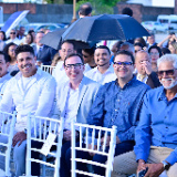 a-group-of-people-smile-during-a-groundbreaking-ceremony