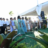 a-choir-sings-outside-at-a-groundbreaking-ceremony